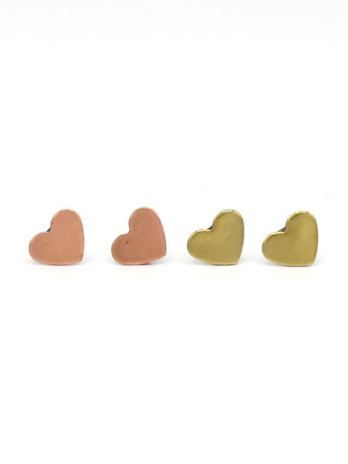 Four heart-shaped earrings in different colors on a white background